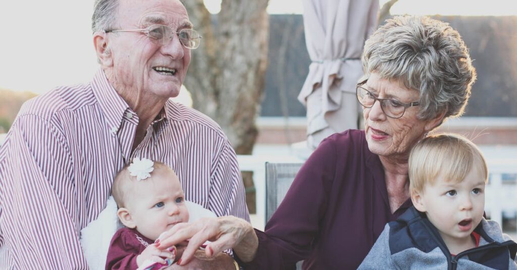 Grandmother and Grandfather Holding Children on Their Lap